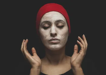 a women applying mask as a part of Korean skincare routine for oily skin