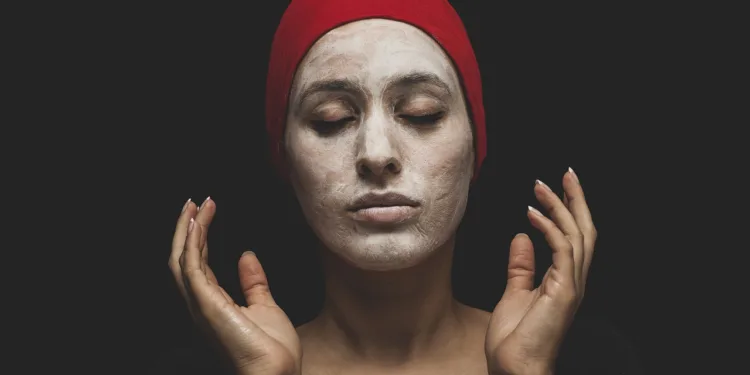 a women applying mask as a part of Korean skincare routine for oily skin