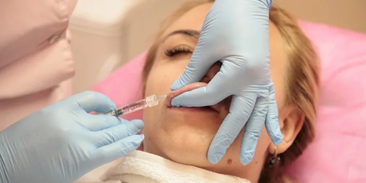 a girl getting Korean cherry lips treatment