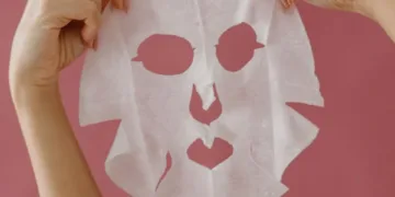 Korean sheet mask being held by a girl for photoshoot