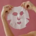 Korean sheet mask being held by a girl for photoshoot