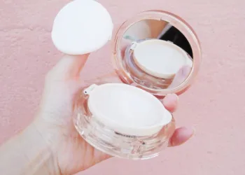 a closeup of a girl holding Korean cushion compact