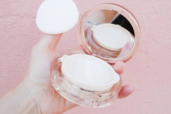 a closeup of a girl holding Korean cushion compact